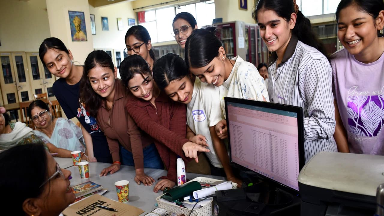 Students check their results after CBSE announcement (Photo/ANI) Students check their results after CBSE announcement (Photo/ANI)