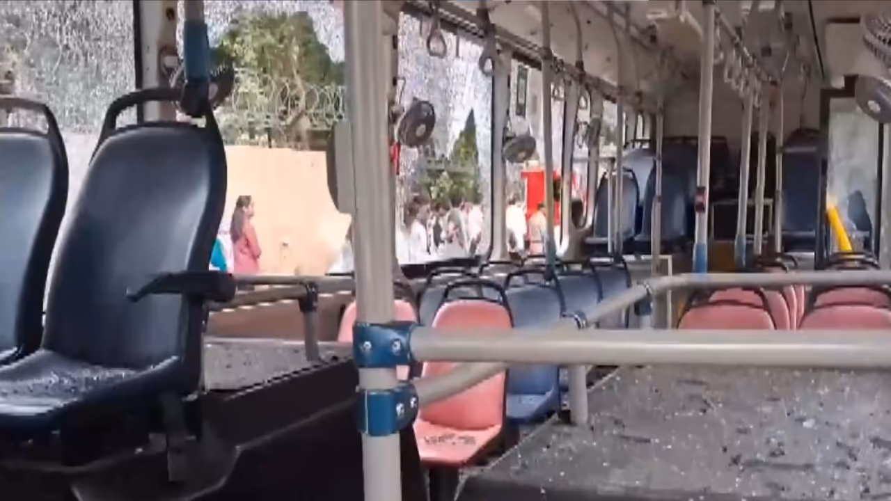 Angry mob damaged the bus (Photo/ANI) Angry mob damaged the bus (Photo/ANI)