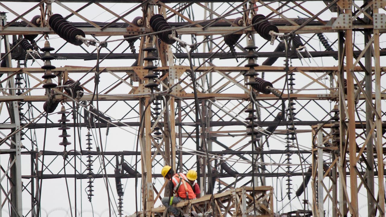 Employees work on electric pylons at a power station (File Photo/ANI) Employees work on electric pylons at a power station (File Photo/ANI)