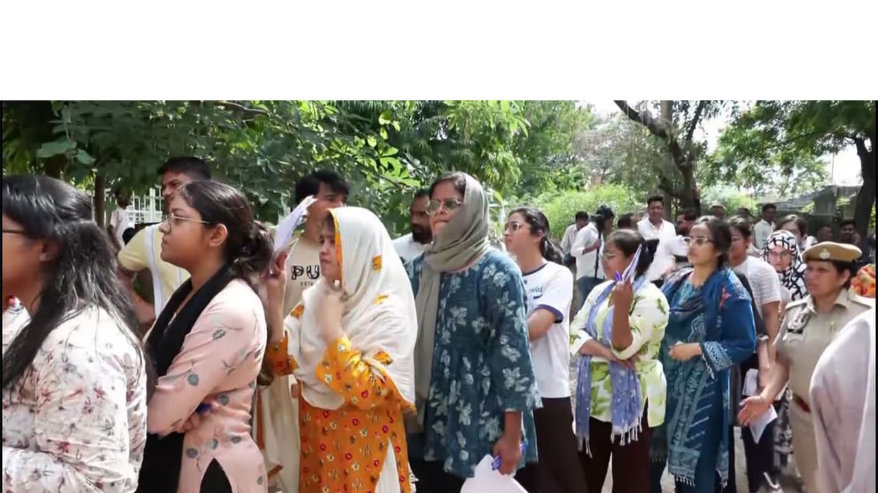 Candidates gather outside the Satya Sai PG Girls College examination center (Photo/ANI) Candidates gather outside the Satya Sai PG Girls College examination center (Photo/ANI)