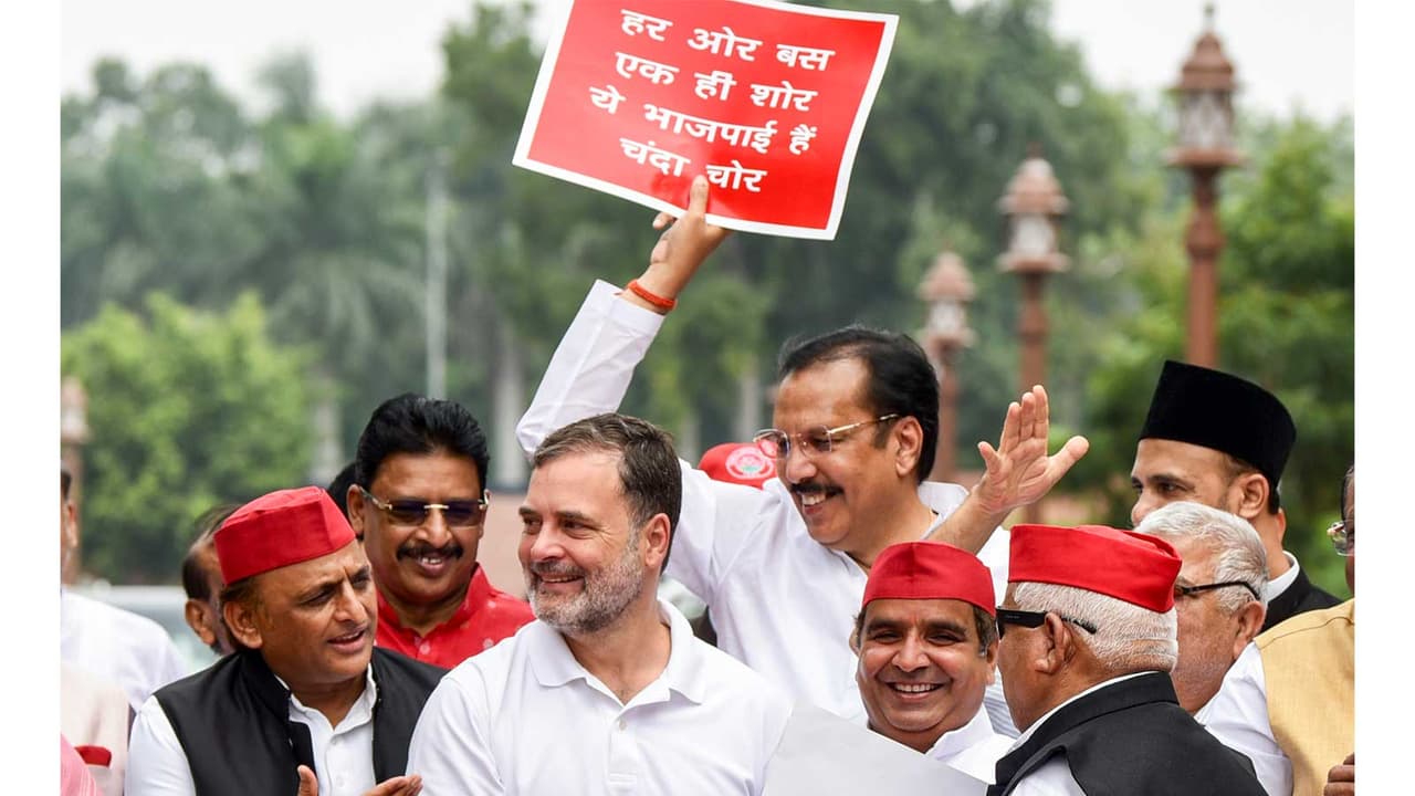 Opposition parties protest in Parliament on Monday (Photo/ANI) Opposition parties protest in Parliament on Monday (Photo/ANI)