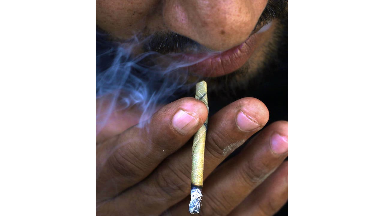 A man smokes 'Bidi', a small hand rolled cigarette (File Photo/ANI) A man smokes 'Bidi', a small hand rolled cigarette (File Photo/ANI)