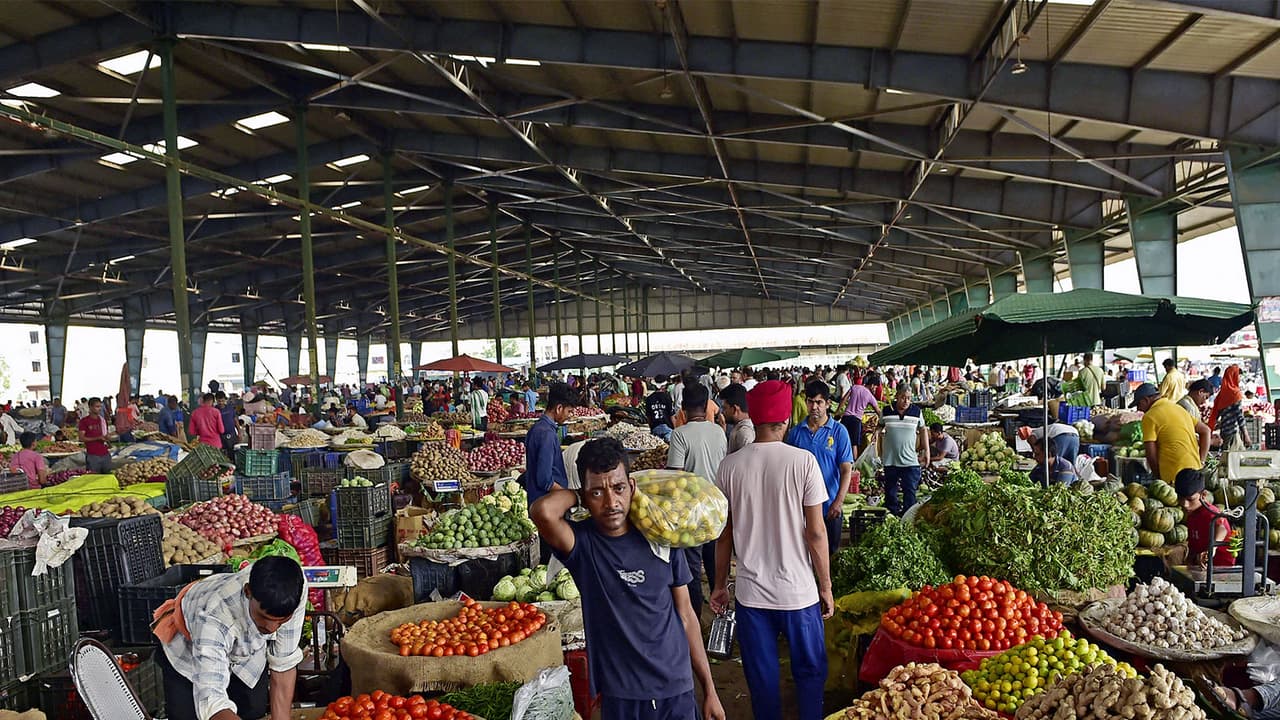 People buying vegetable at a wholesale market (File Photo/ANI) People buying vegetable at a wholesale market (File Photo/ANI)