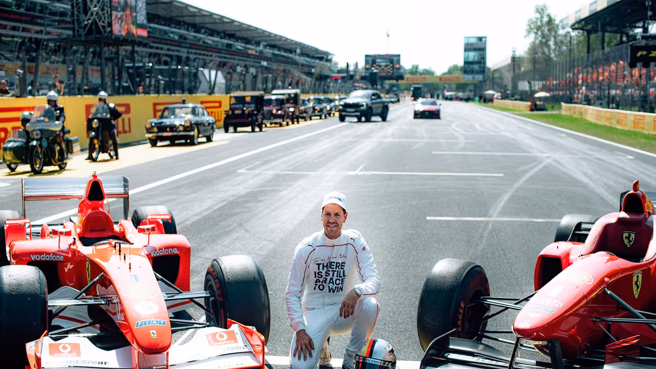 Sebastian Vettel poses with Michael Schumacher's F2002 and F310 cars on the grid at Monza. (Photo: X/ @F1) Sebastian Vettel poses with Michael Schumacher's F2002 and F310 cars on the grid at Monza. (Photo: X/ @F1)