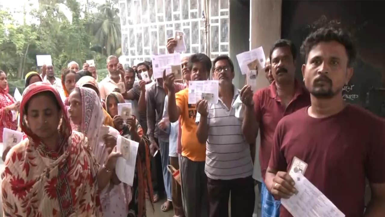 Voters queue up at a polling station to cast vote for the ongoing repolling at Falta assembly constituency (Photo/ANI) Voters queue up at a polling station to cast vote for the ongoing repolling at Falta assembly constituency (Photo/ANI)