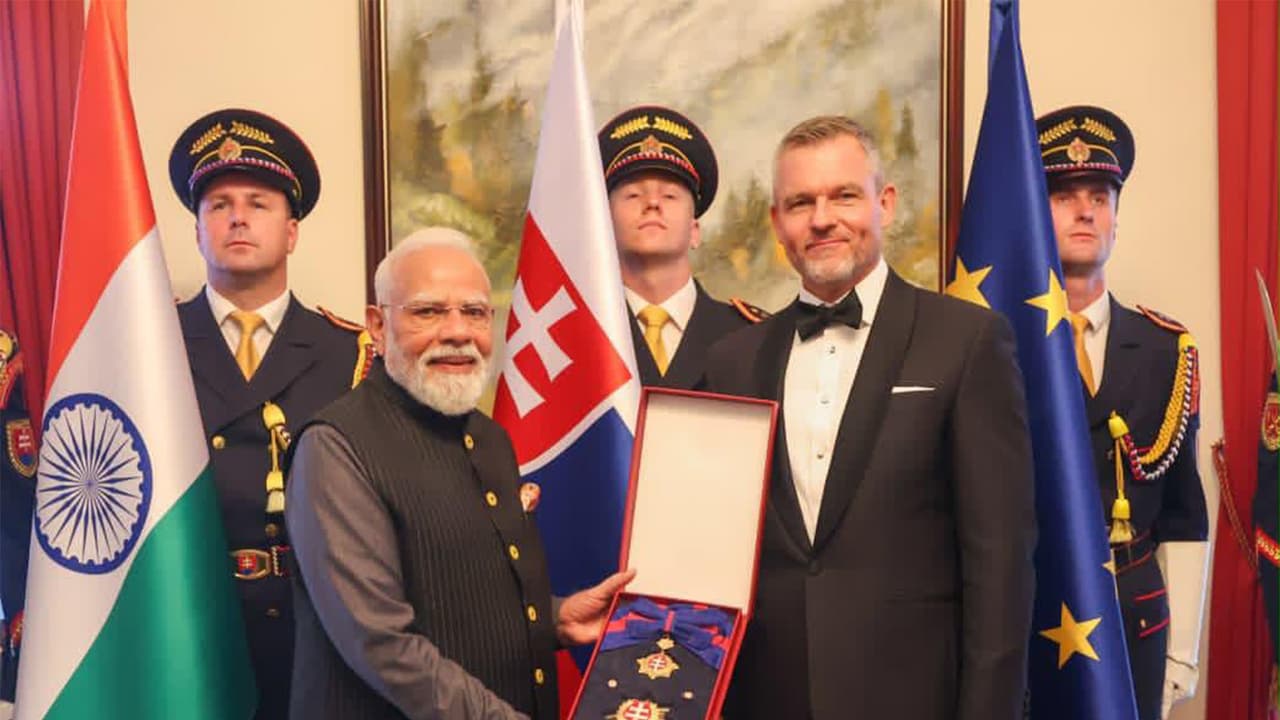 Slovak President Peter Pellegrini conferres its highest honour, the Order of the White Double Cross (1st Class) on PM Narendra Modi (Photo/ANI) Slovak President Peter Pellegrini conferres its highest honour, the Order of the White Double Cross (1st Class) on PM Narendra Modi (Photo/ANI)