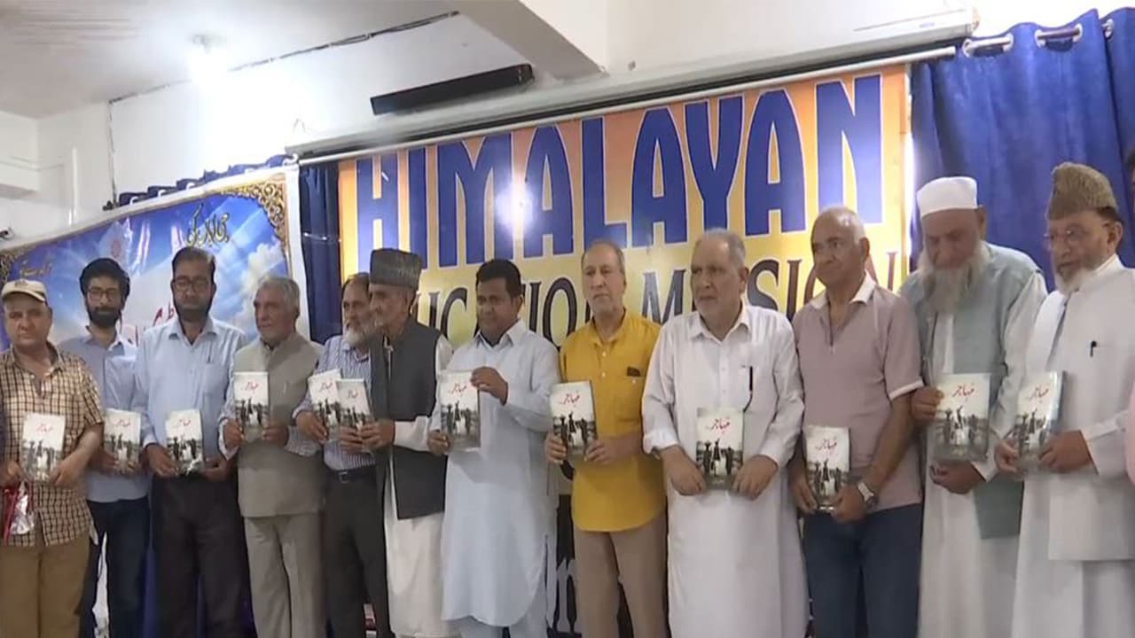 Launch of "Muhajer", a Pahari language novel authored by Mohammad Iqbal Shawl during a literary meet in Rajouri, Jammu and Kashmir (Photo/ANI) Launch of "Muhajer", a Pahari language novel authored by Mohammad Iqbal Shawl during a literary meet in Rajouri, Jammu and Kashmir (Photo/ANI)