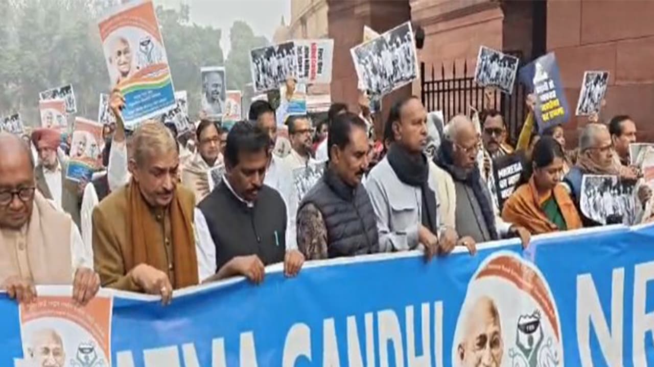 Opposition MPs protest over MNERAGA rename issue in Parliament premises. (Photo/ANI) Opposition MPs protest over MNERAGA rename issue in Parliament premises. (Photo/ANI)