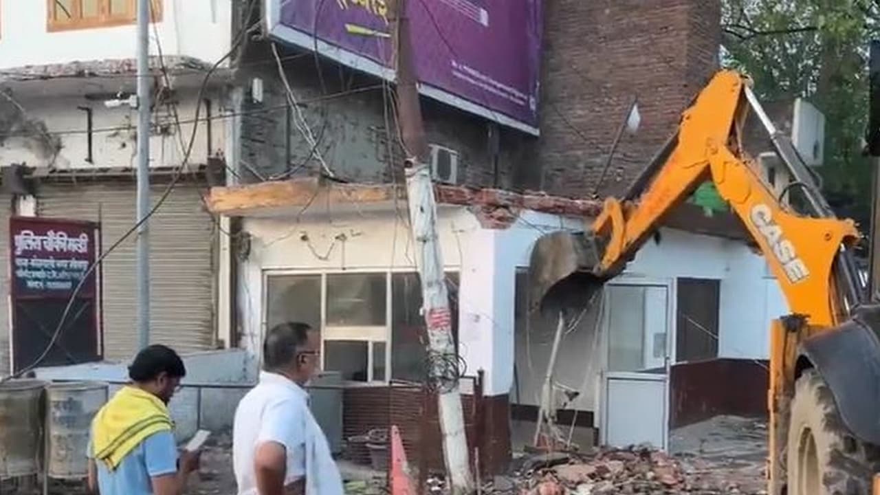 Bulldozer operations have commenced for the widening of the Captain Manoj Pandey intersection. (Photo/ANI) Bulldozer operations have commenced for the widening of the Captain Manoj Pandey intersection. (Photo/ANI)