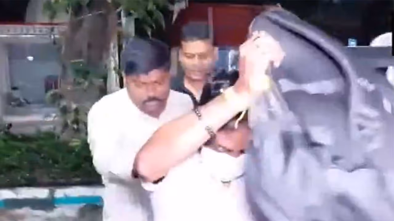Panihati Municipality Chairman Somnath Dey was brought to Khardah Police Station after being arrested in Bengaluru (Photo/ANI) Panihati Municipality Chairman Somnath Dey was brought to Khardah Police Station after being arrested in Bengaluru (Photo/ANI)