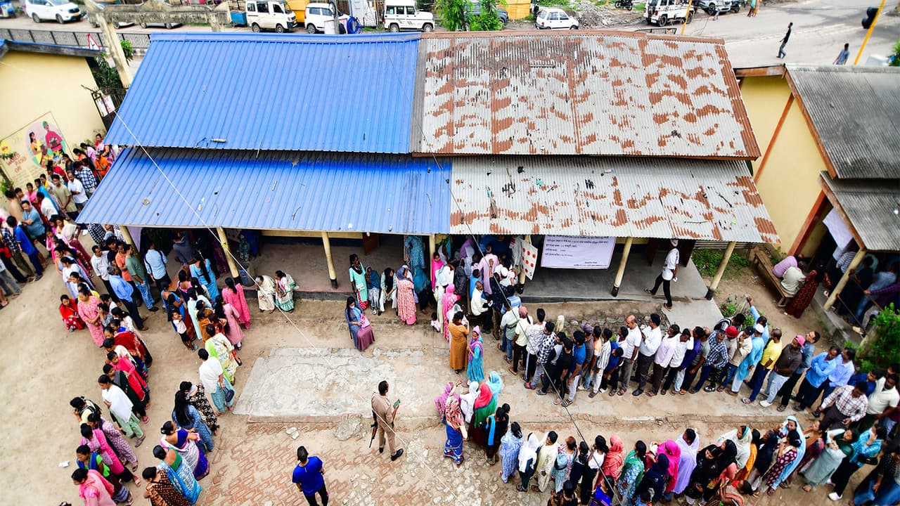 Voters queue up at a polling booth in Guwahati (Photo/ANI) Voters queue up at a polling booth in Guwahati (Photo/ANI)