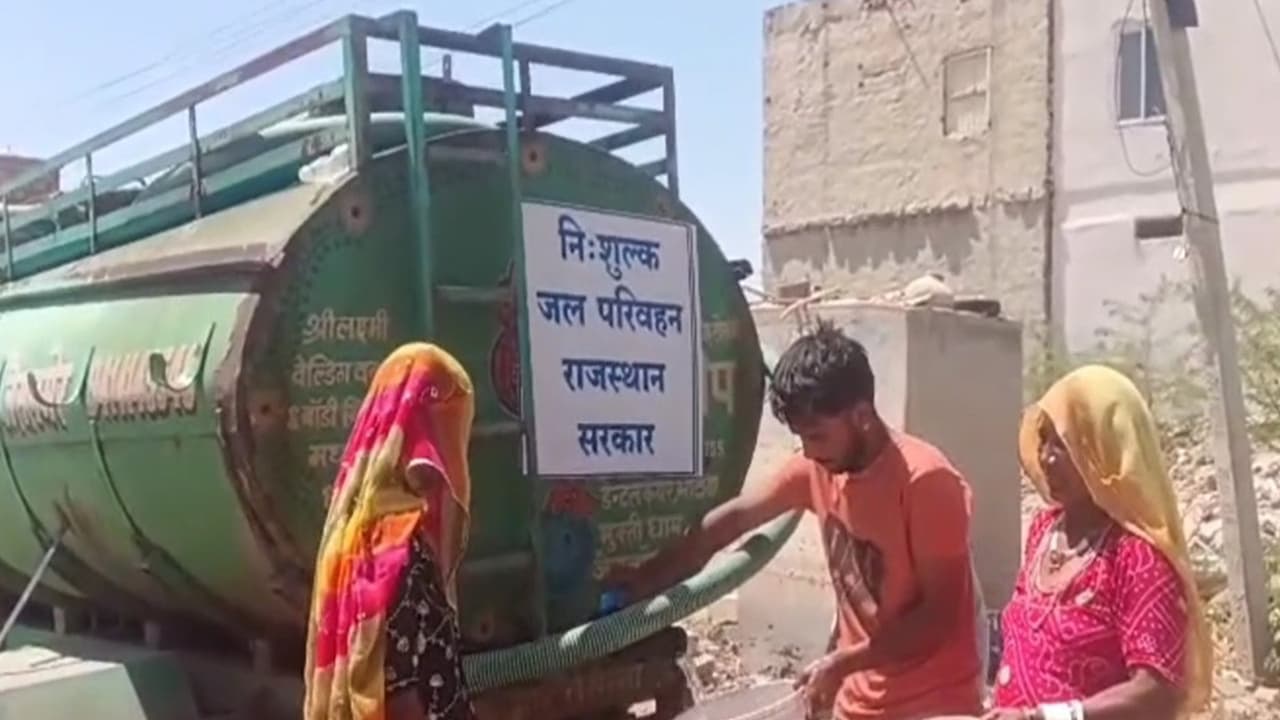 Residents in Jaisalmer taking water from PHED deployed tankers in Jaisalmer (Photo/ANI) Residents in Jaisalmer taking water from PHED deployed tankers in Jaisalmer (Photo/ANI)