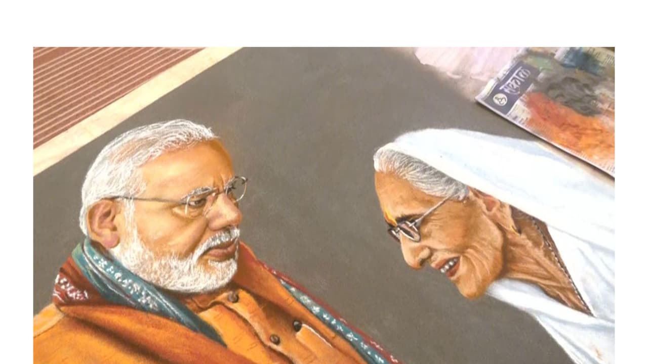 Rangoli artist Somnath Bhongle from Pune has created a special portrait of PM Modi and his late mother (Photo/ANI) Rangoli artist Somnath Bhongle from Pune has created a special portrait of PM Modi and his late mother (Photo/ANI)