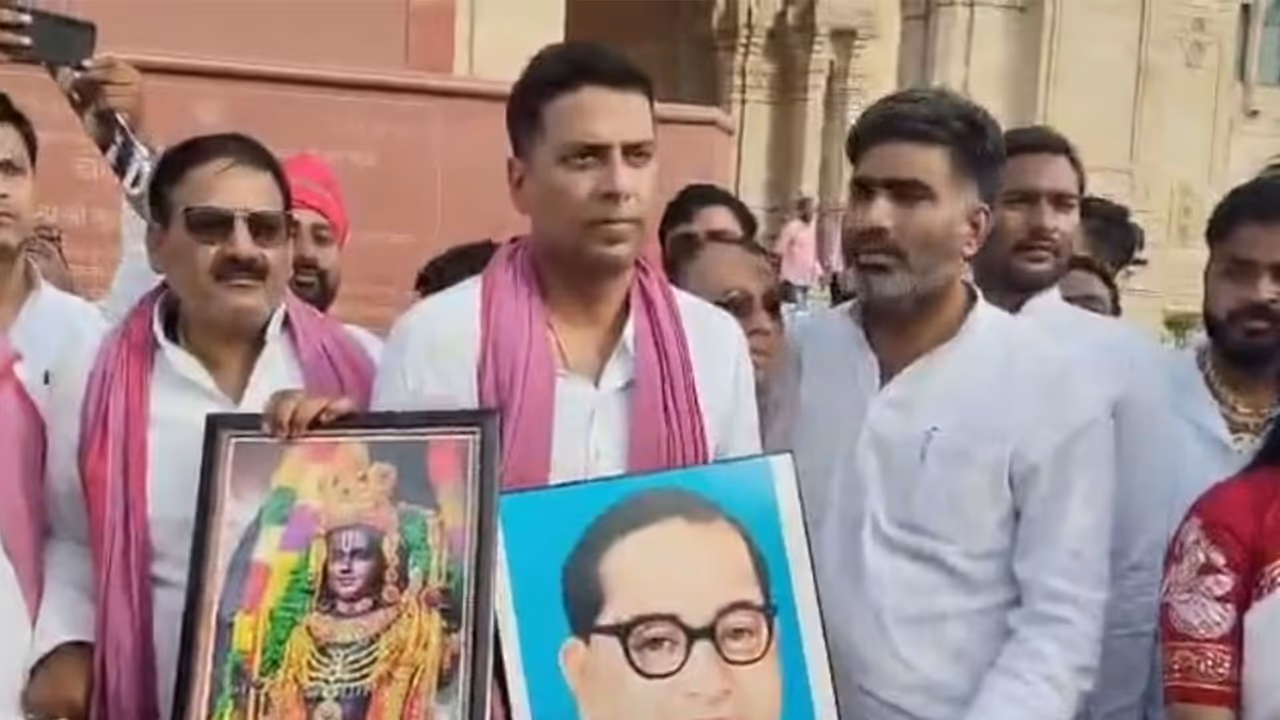Samajwadi Party MLA Sachin Yadav protesting outside Assembly after his suspension (Photo/ANI) Samajwadi Party MLA Sachin Yadav protesting outside Assembly after his suspension (Photo/ANI)