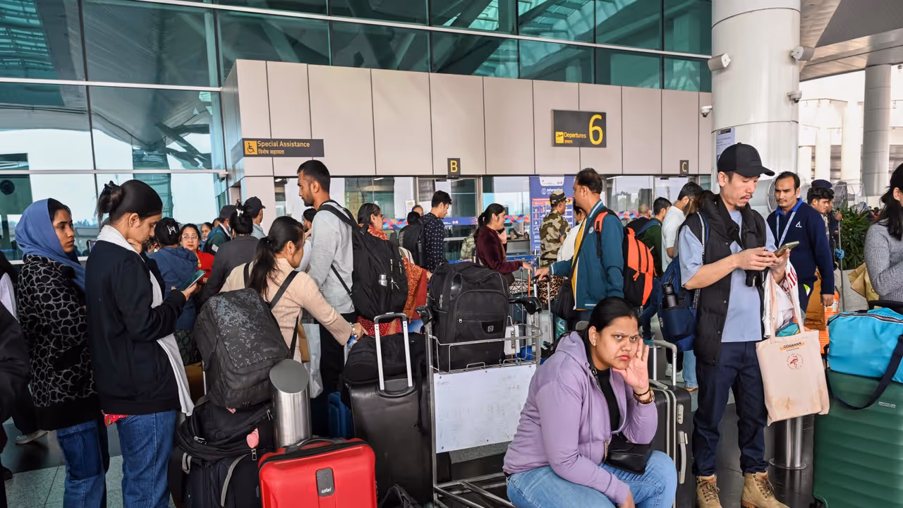 Flight passengers wait with their baggage as many IndiGo flight services stand cancelled in Delhi Airport (File Photo/ANI) Flight passengers wait with their baggage as many IndiGo flight services stand cancelled in Delhi Airport (File Photo/ANI)