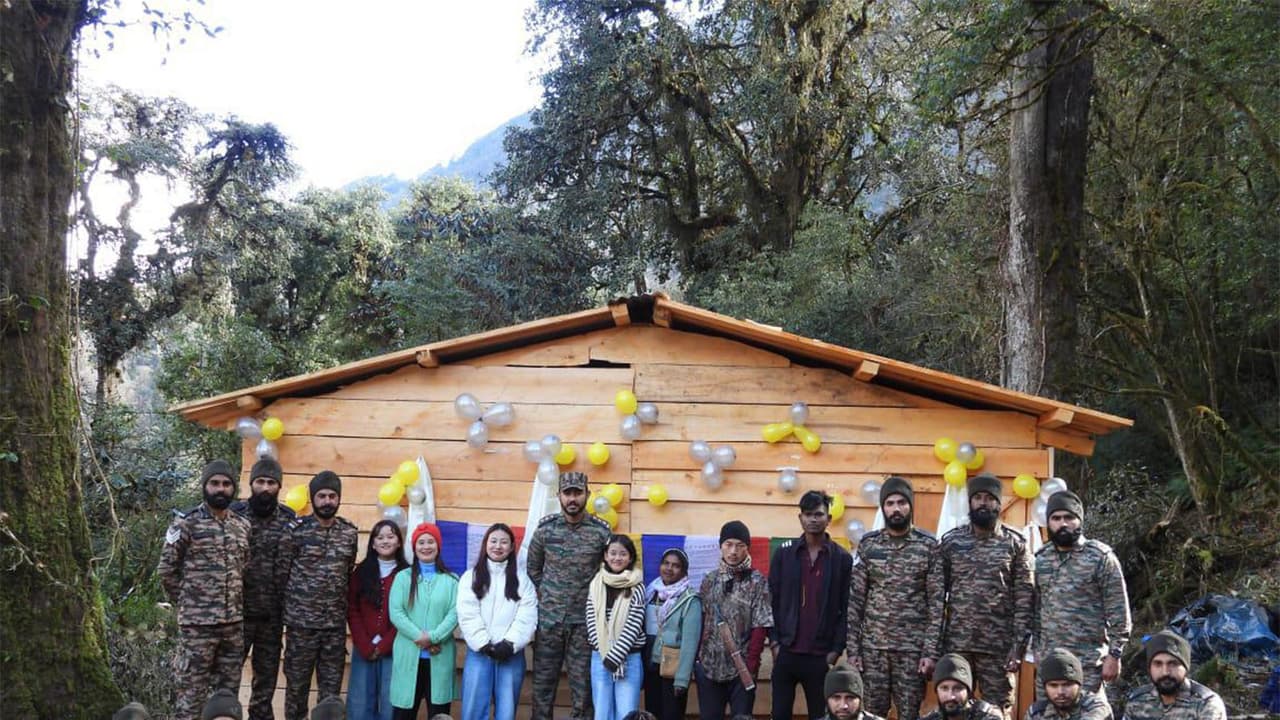 Indian Army troops with locals infront of log hut Ojugo village (Photo/ANI) Indian Army troops with locals infront of log hut Ojugo village (Photo/ANI)