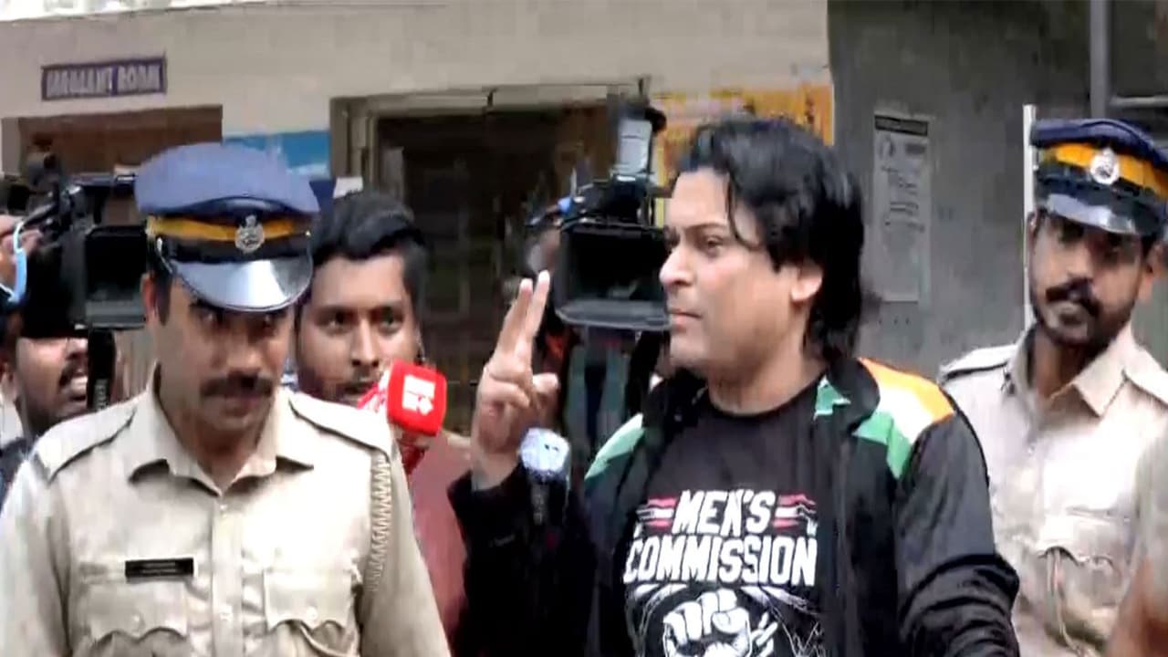 Activist Rahul Easwar speaks to reporters while being taken for a medical examination in Thiruvananthapuram. (Photo/ANI)