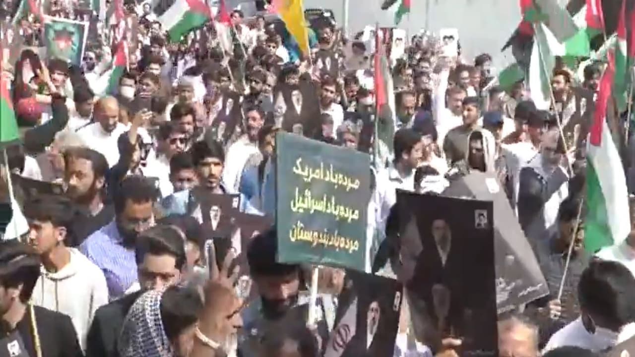 Participants carry flags and portraits during a Youm e Quds rally in Islamabad to express support for the Palestinian cause and protest against Israel. (Photo/ANI) Participants carry flags and portraits during a Youm e Quds rally in Islamabad to express support for the Palestinian cause and protest against Israel. (Photo/ANI)