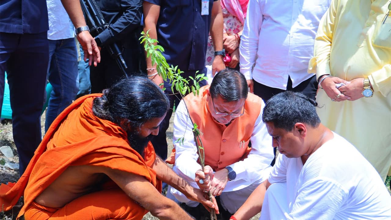 Uttarakhand Chief Minister Pushkar Singh Dhami with Yog Guru Baba Ramdev (Photo/ANI) Uttarakhand Chief Minister Pushkar Singh Dhami with Yog Guru Baba Ramdev (Photo/ANI)