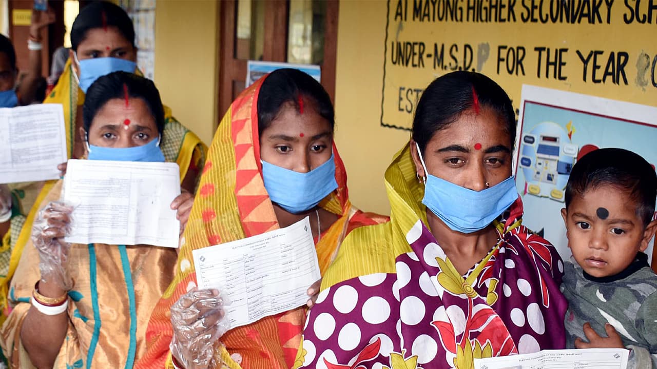 A file photo of people queuing up outside a polling station during 2021 ssembly polls in Assam. (Photo/ANI) A file photo of people queuing up outside a polling station during 2021 ssembly polls in Assam. (Photo/ANI)
