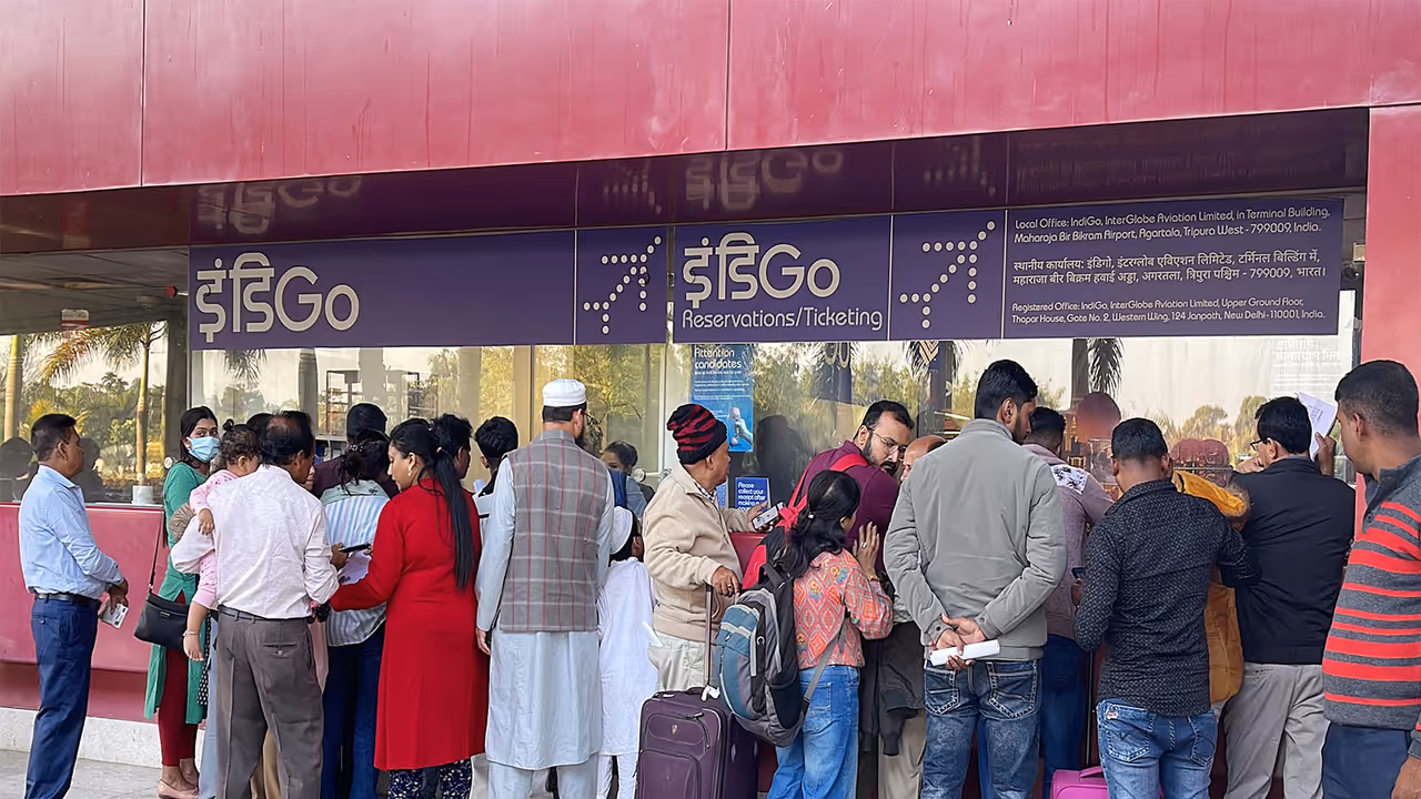 Passengers wait with their baggage as many IndiGo flight services stand cancelled (Photo/ANI)