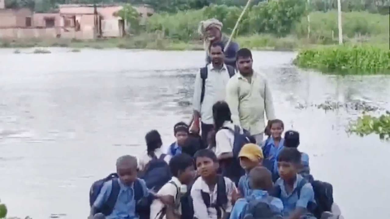 Students coming in boat to school in Bihar (Photo/ANI) Students coming in boat to school in Bihar (Photo/ANI)