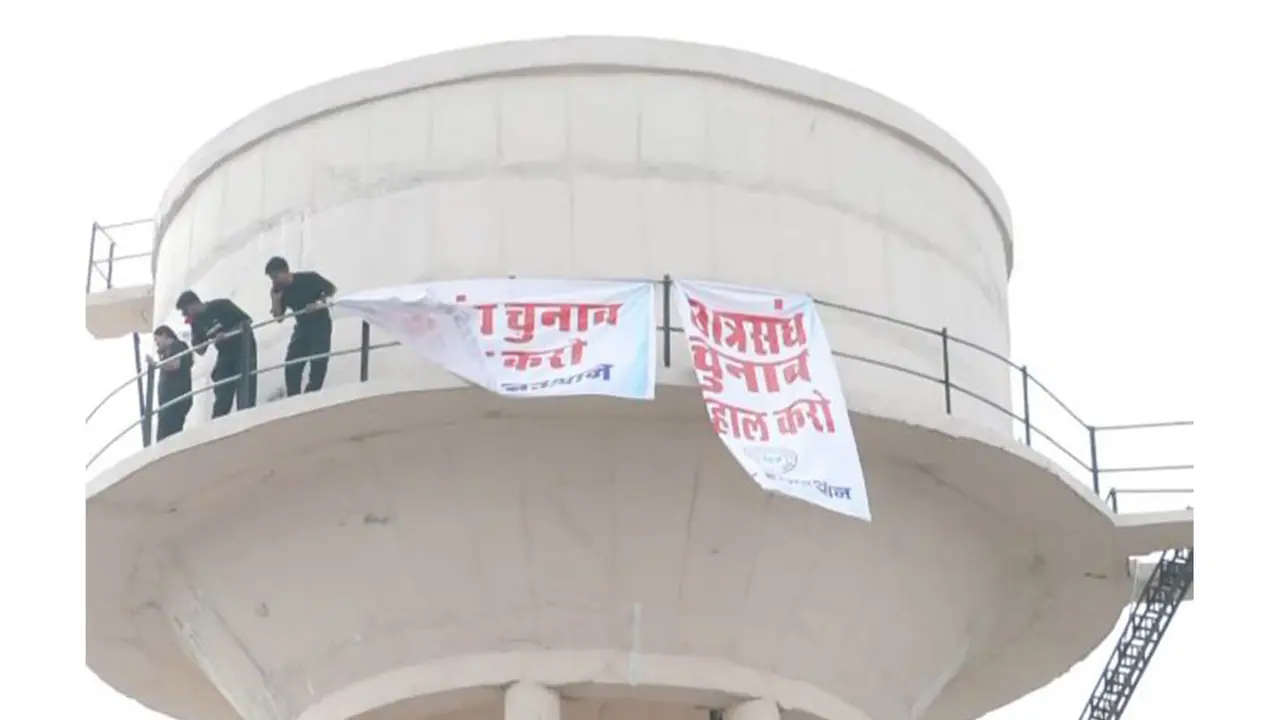 NSUI activists climb water tank in Jaipur over student union elections demand (Photo/ANI) NSUI activists climb water tank in Jaipur over student union elections demand (Photo/ANI)