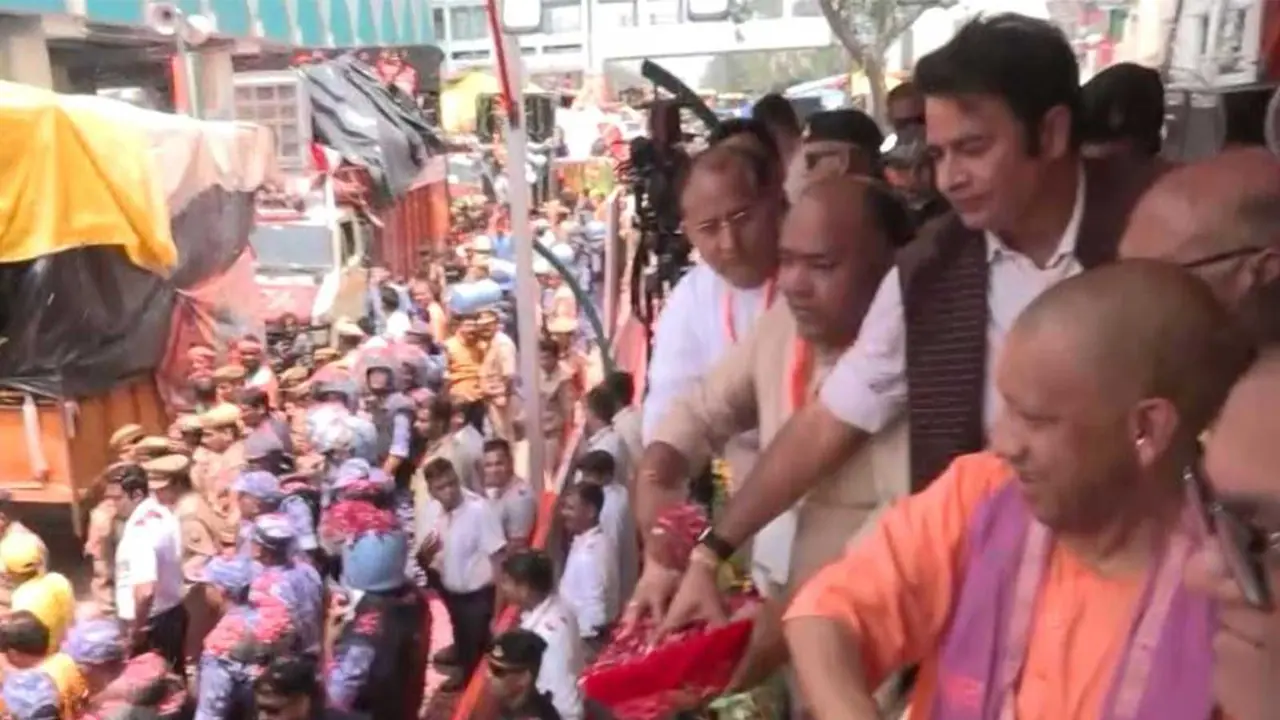 Uttar Pradesh Chief Minister Yogi Adityanath showers flower petals on Kanwariyas in Meerut (Photo/ANI) Uttar Pradesh Chief Minister Yogi Adityanath showers flower petals on Kanwariyas in Meerut (Photo/ANI)
