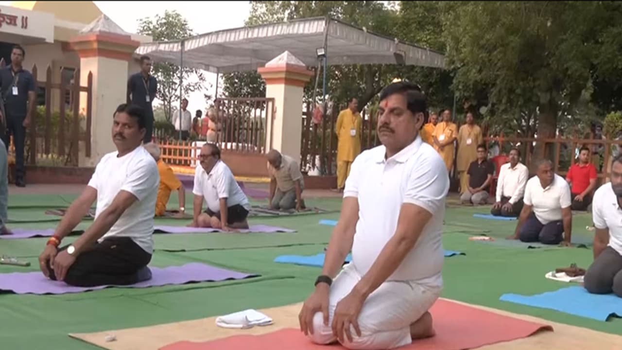 MP CM Mohan Yadav performing Yoga (Photo / ANI) MP CM Mohan Yadav performing Yoga (Photo / ANI)