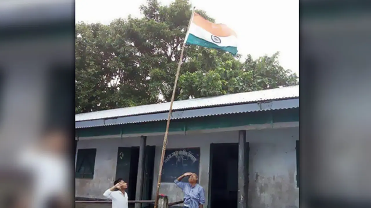 There is a tragic story behind this viral picture of teachers students hoisting the flag in flooded Assam There is a tragic story behind this viral picture of teachers students hoisting the flag in flooded Assam