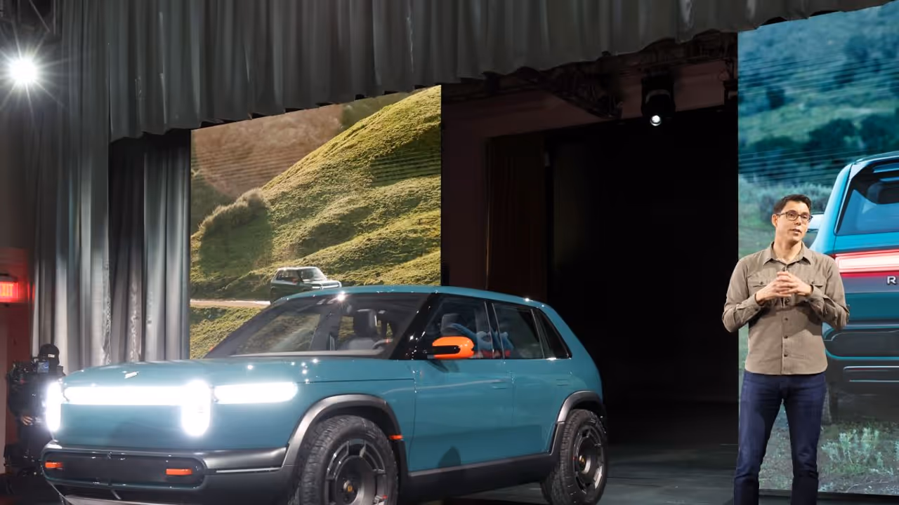 Rivian Stock Jumps After Benchmark’s ‘Buy’ Rating, 38% Upside View: Retail Holds Back Optimism Rivian Stock Jumps After Benchmark’s ‘Buy’ Rating, 38% Upside View: Retail Holds Back Optimism