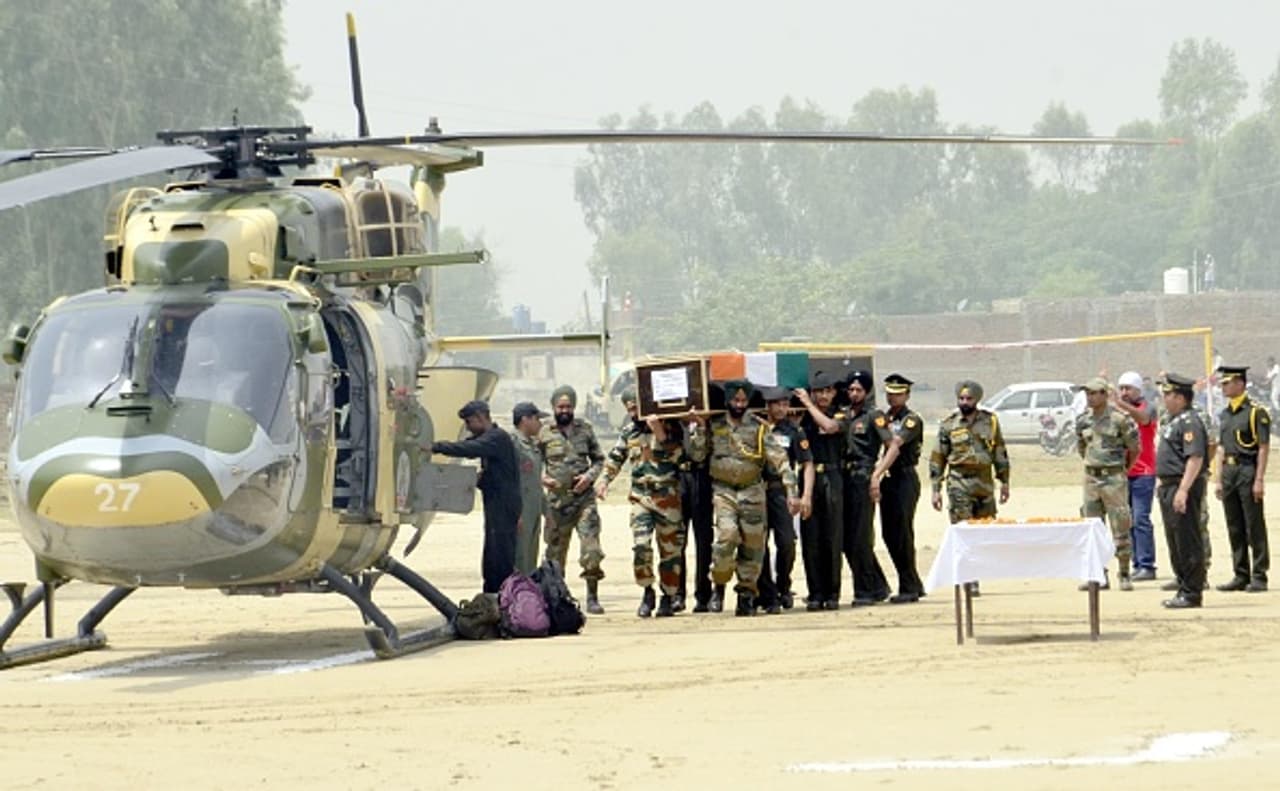Slain soldier Paramjit Singh cremated with military honours Slain soldier Paramjit Singh cremated with military honours