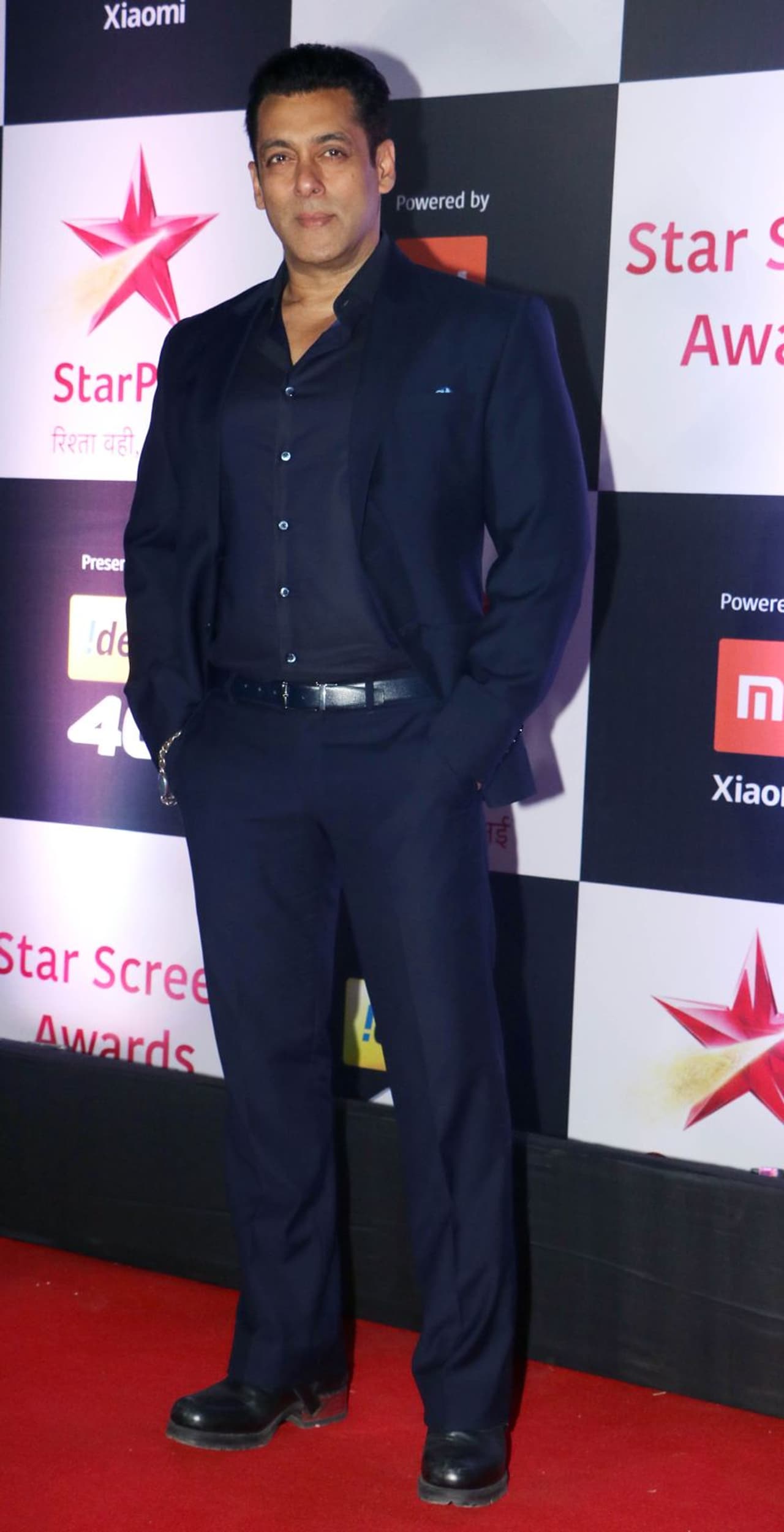 Salman Khan dressed in an all navy blue outfit with his trademark chain bracelet. Salman Khan dressed in an all navy blue outfit with his trademark chain bracelet.