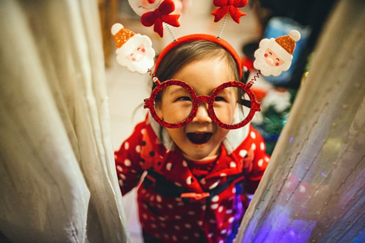When the toddler wears Santa Claus eyeglasses, headband and smiles joyfully at the camera, your worries fade away When the toddler wears Santa Claus eyeglasses, headband and smiles joyfully at the camera, your worries fade away
