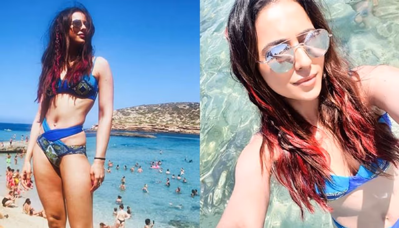 రకుల్ ప్రీత్ సింగ్ ని బికినీలో చూడటం ఆశ్చర్యమేమీలేదు. ఎందుకంటే ఆమె హీరోయిన్. అయితే తన బాడీలాంగ్వేజీని దృష్టిలోపెట్టుకుని సాధారణంగా అలాంటి డ్రస్ లలో కనపడేది కాదు. కానీ ఇప్పుడు రూట్ మార్చింది. తనలో అందాలు ప్రపంచానికి చూపకపోతే కష్టమని గుర్తించింది. అందుకే ఇదిగో ఇలా రెచ్చిపోతోంది. ఈ ఫొటోతో ఆమె కుర్రకారుకు హాట్ ఫేవరెట్ గా మరోసారి మారిపోయిందనటంలో సందేహం లేదు.