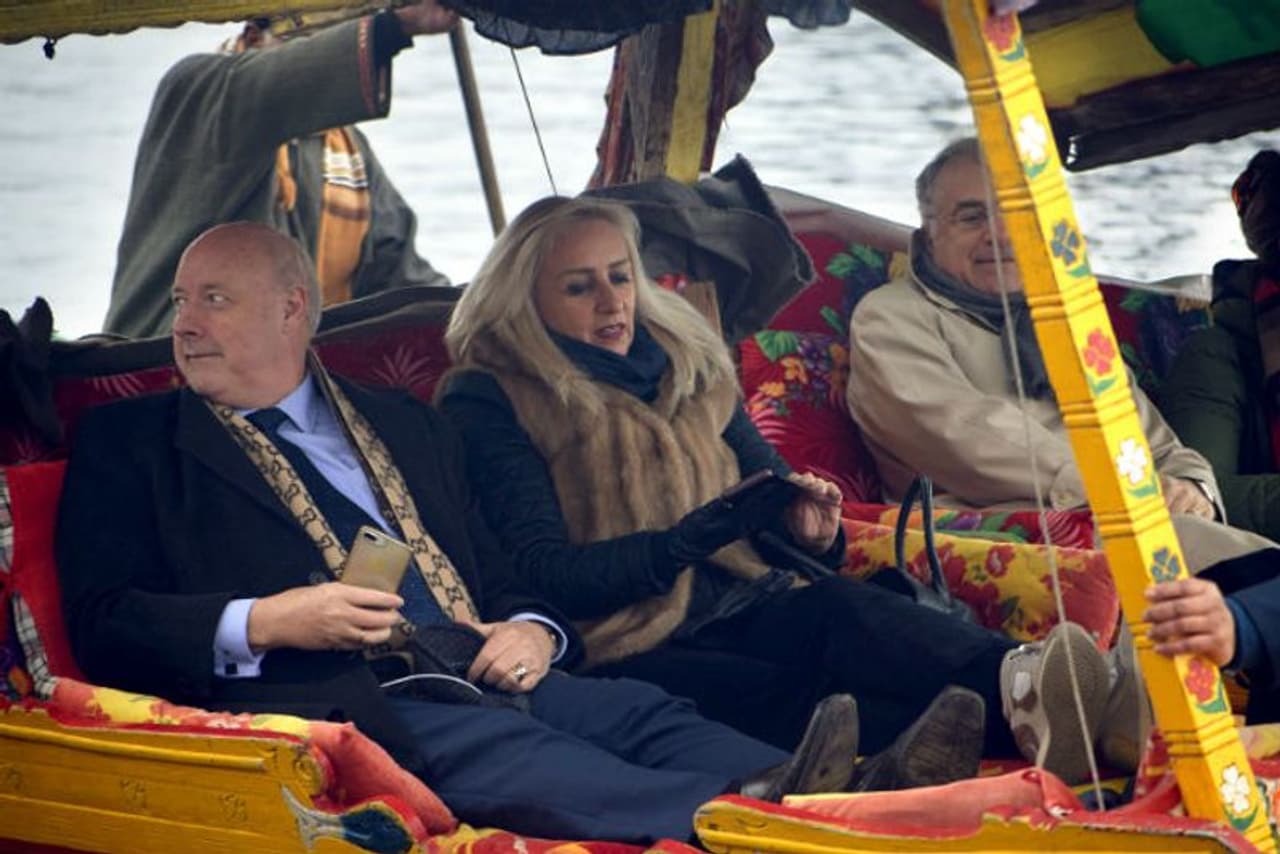 The 25 foreign envoys of the second batch take a Shikara ride during their visit, at Dal Lake in Srinagar on Wednesday. (ANI Photo)