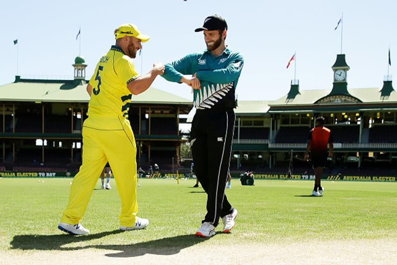 Captains Aaron Finch (Australia) and Kane Williamson (New Zealand) greet each other by touching elbows and fists