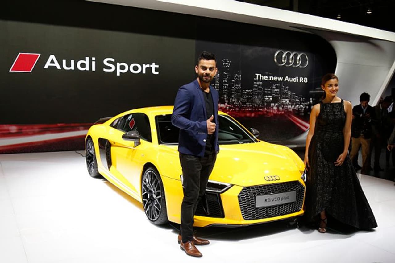 Kohli and Bollywood Actres Alia Bhatt with RB V10 Plus Audi during the Indian Auto Expo in Greater Noida on February 3, 2016 Kohli and Bollywood Actres Alia Bhatt with RB V10 Plus Audi during the Indian Auto Expo in Greater Noida on February 3, 2016