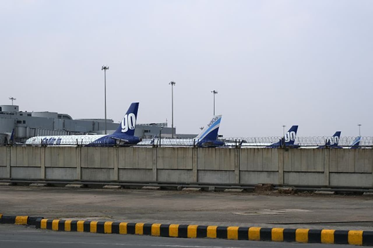 <p>Grounded aircraft stand at Terminal 2 at the Indira Gandhi International Airport during a lockdown implemented due to the coronavirus in New Delhi</p>
