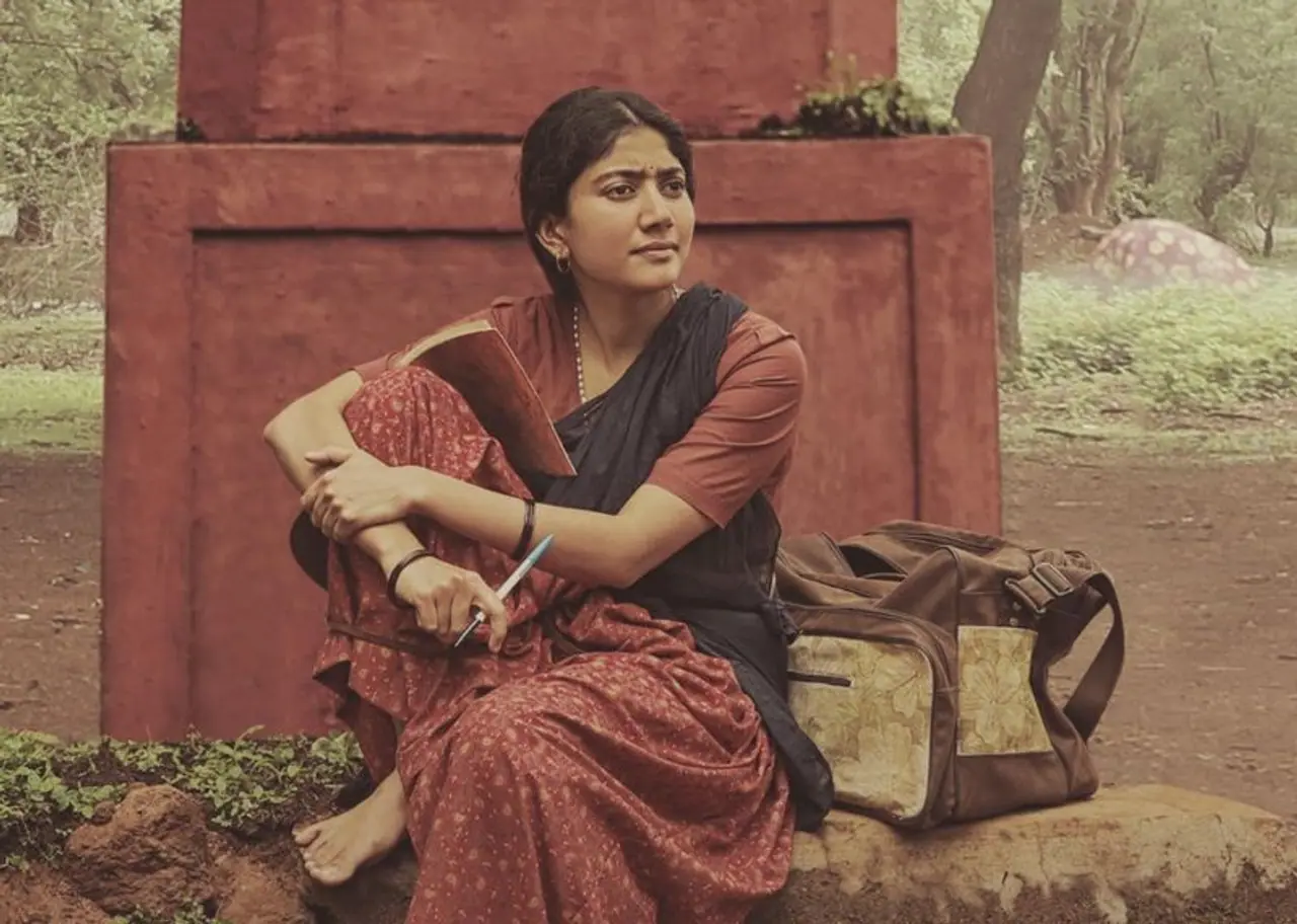 <p>Sai Pallavi, who is often seen playing the girl next door and college sweetheart, will now portray the character of a poor girl, who gets depressed due to love failure and becomes a Naxalite. </p> <p>Sai Pallavi, who is often seen playing the girl next door and college sweetheart, will now portray the character of a poor girl, who gets depressed due to love failure and becomes a Naxalite. </p>