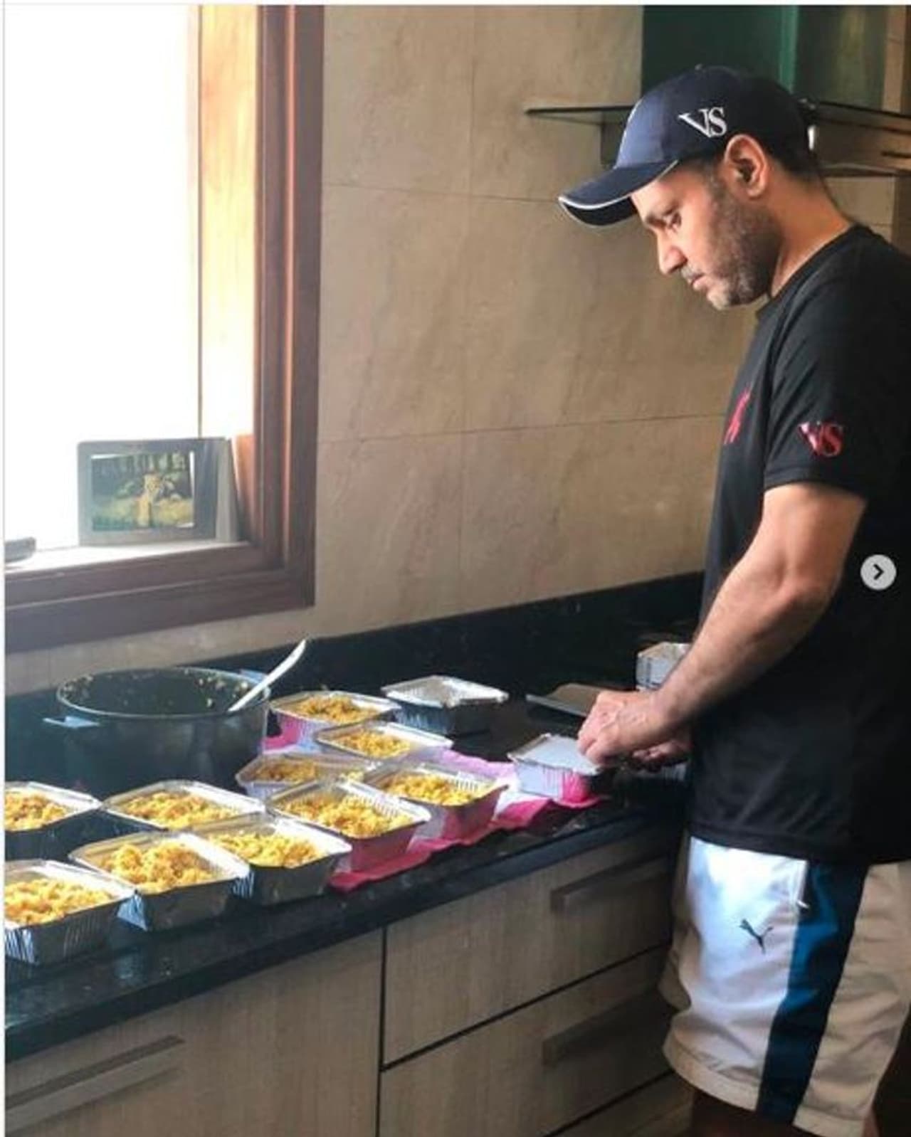 <p>Sehwag wrote on Twitter, "The satisfaction of cooking and packing food from the comfort of your own homes and courtsey the wonderful people at @udayfoundation distributing it to migrant labourers is the beauty of #GharSeSewa .If you would like to offer food seva for 100 people please DM to @SehwagFoundatn (sic)."</p> <p>Sehwag wrote on Twitter, "The satisfaction of cooking and packing food from the comfort of your own homes and courtsey the wonderful people at @udayfoundation distributing it to migrant labourers is the beauty of #GharSeSewa .If you would like to offer food seva for 100 people please DM to @SehwagFoundatn (sic)."</p>