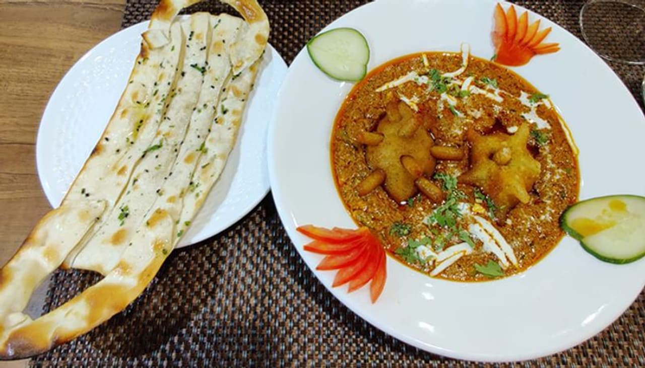 <p>A Jodhpur restaurant has introduced two corona themed dishes as part of its menu. Yes, Vedic multi cuisine restaurant, which serves traditional Rajasthani and North Indian cuisine, sells Covid Curry and Mask Naan.</p> <p>A Jodhpur restaurant has introduced two corona themed dishes as part of its menu. Yes, Vedic multi cuisine restaurant, which serves traditional Rajasthani and North Indian cuisine, sells Covid Curry and Mask Naan.</p>