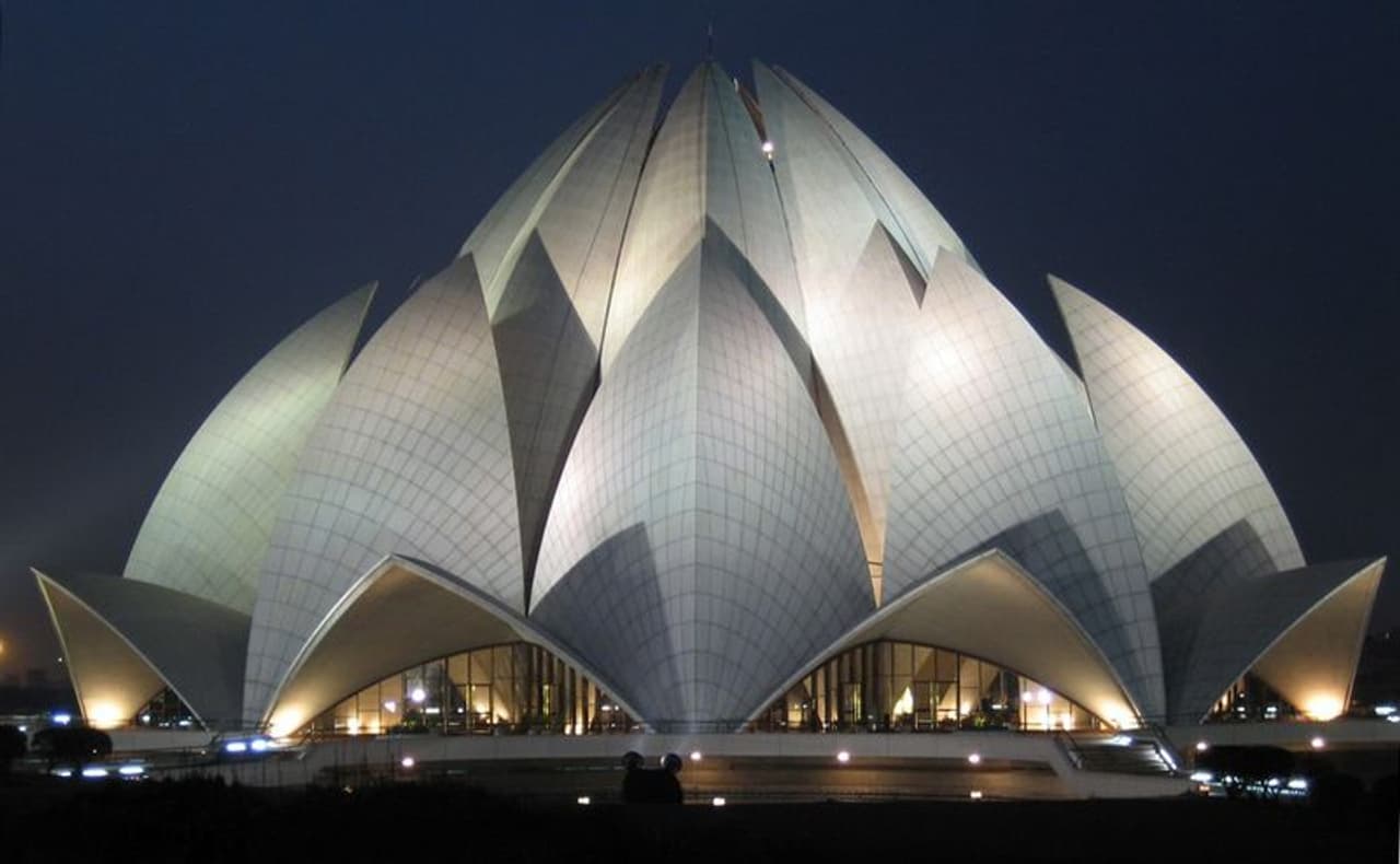 <p><strong>Lotus Temple: </strong>Designed by Iranian American architect Fariborz Sahba is located in New Delhi and is a Bahá’í House of Worship that was completed in 1986. The building is notable for its flower like shape and serves as the Mother Temple of the Indian subcontinent. The building made of white marble is composed of 27 free standing marble clad ‘petals’ arranged in clusters of three to form nine sides, with nine doors opening onto a central hall with height of slightly over 40 metre and a capacity of 2,500 people.</p> <p><strong>Lotus Temple: </strong>Designed by Iranian American architect Fariborz Sahba is located in New Delhi and is a Bahá’í House of Worship that was completed in 1986. The building is notable for its flower like shape and serves as the Mother Temple of the Indian subcontinent. The building made of white marble is composed of 27 free standing marble clad ‘petals’ arranged in clusters of three to form nine sides, with nine doors opening onto a central hall with height of slightly over 40 metre and a capacity of 2,500 people.</p>