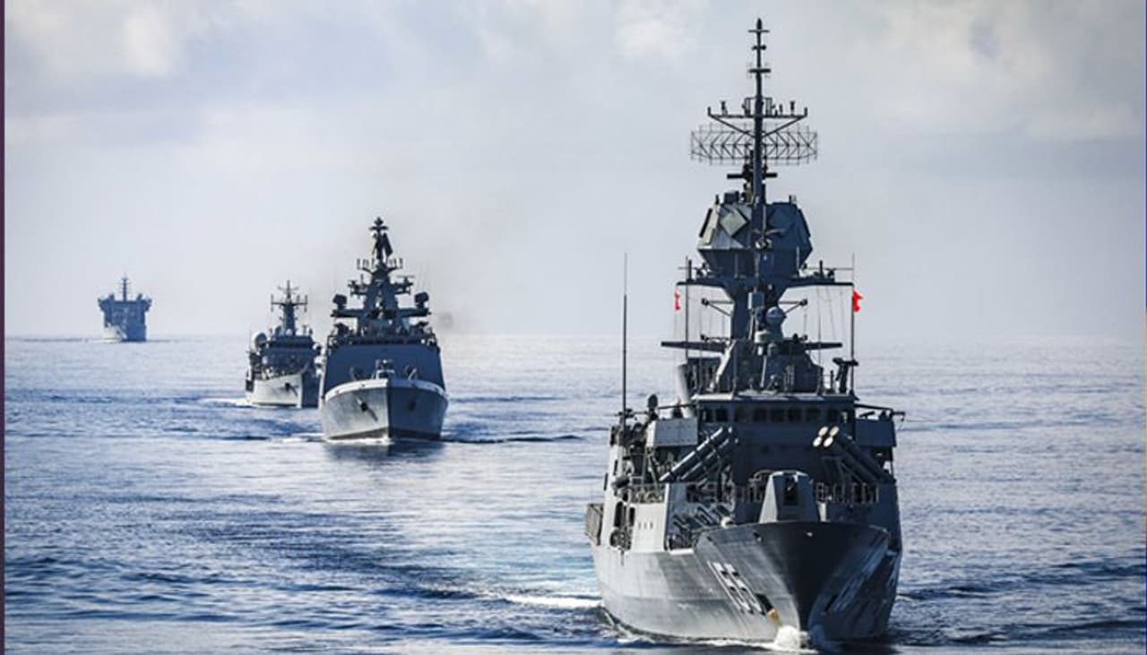 <p>Ships from multiple nations sail in formation during a live fire gunnery exercise as part of Malabar 2020. Malabar is an India led multinational exercise designed to enhance cooperation between Indian Navy (IN), Royal Australian Navy (RAN), Japan Maritime Self Defense Force (JMSDF) and U.S. maritime forces. (U.S. Navy photo by Mass Communication Specialist 2nd Class Markus Castaneda/Released)</p>