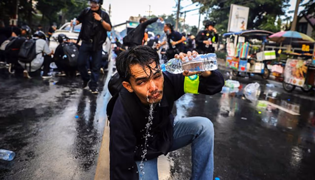 <p>A protester who was exposed to tear gas washes his face after police fired tear gas and water canon to try and disperse protesters outside Parliament on November 17, 2020 in Bangkok, Thailand. The demonstrators gathered outside parliament, on Tuesday, as the Thai government met to discuss amendments to the country's constitution. (Photo by Lauren DeCicca/Getty Images)</p> <p>A protester who was exposed to tear gas washes his face after police fired tear gas and water canon to try and disperse protesters outside Parliament on November 17, 2020 in Bangkok, Thailand. The demonstrators gathered outside parliament, on Tuesday, as the Thai government met to discuss amendments to the country's constitution. (Photo by Lauren DeCicca/Getty Images)</p>