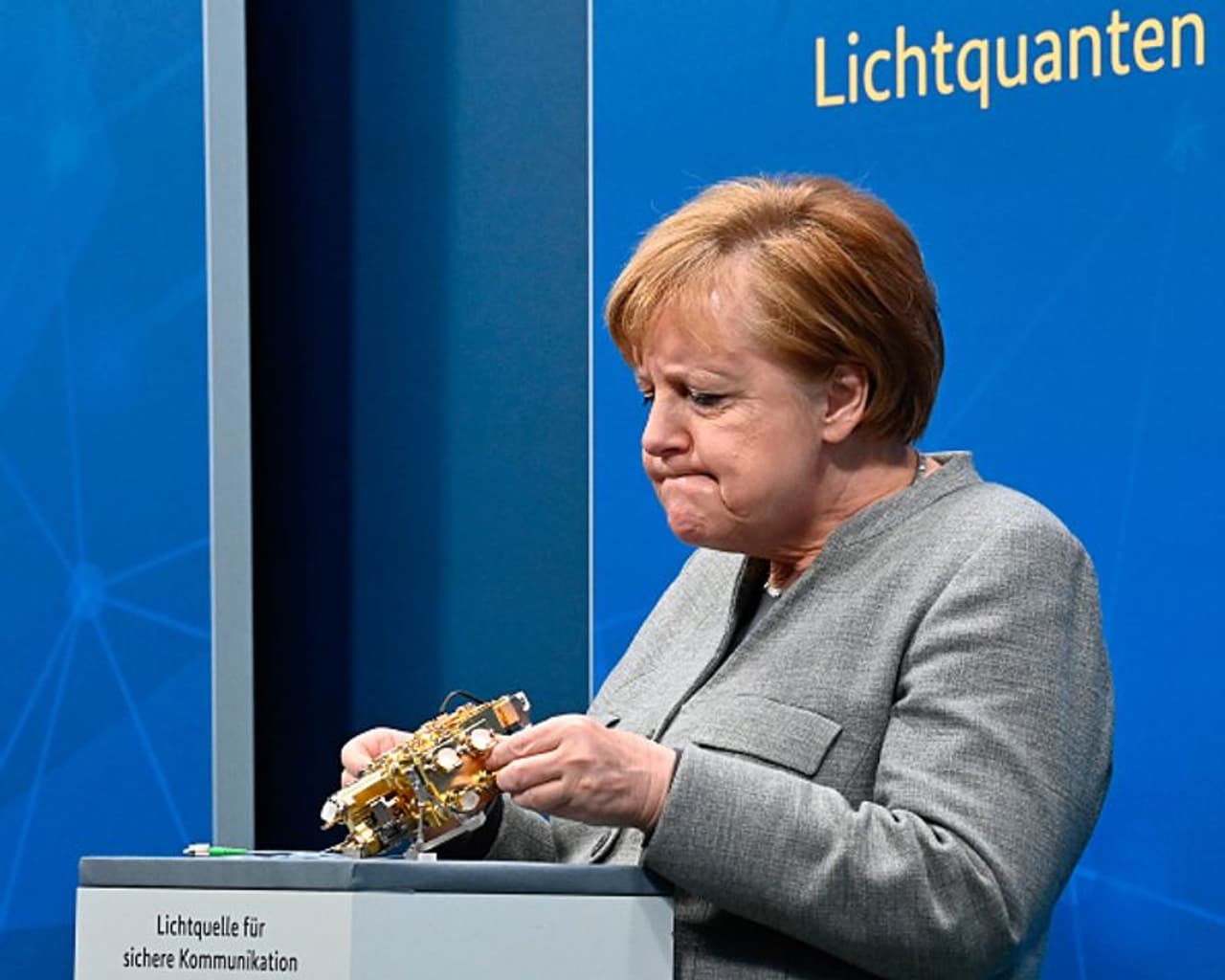 <p>German Chancellor Angela Merkel looks at a light engine for secure communication as she takes virtually part in the Digital Summit 2020 at the Chancellery on December 1, 2020 in Berlin, Germany. (Photo by Tobias Schwarz Pool/Getty Images)</p> <p>German Chancellor Angela Merkel looks at a light engine for secure communication as she takes virtually part in the Digital Summit 2020 at the Chancellery on December 1, 2020 in Berlin, Germany. (Photo by Tobias Schwarz Pool/Getty Images)</p>