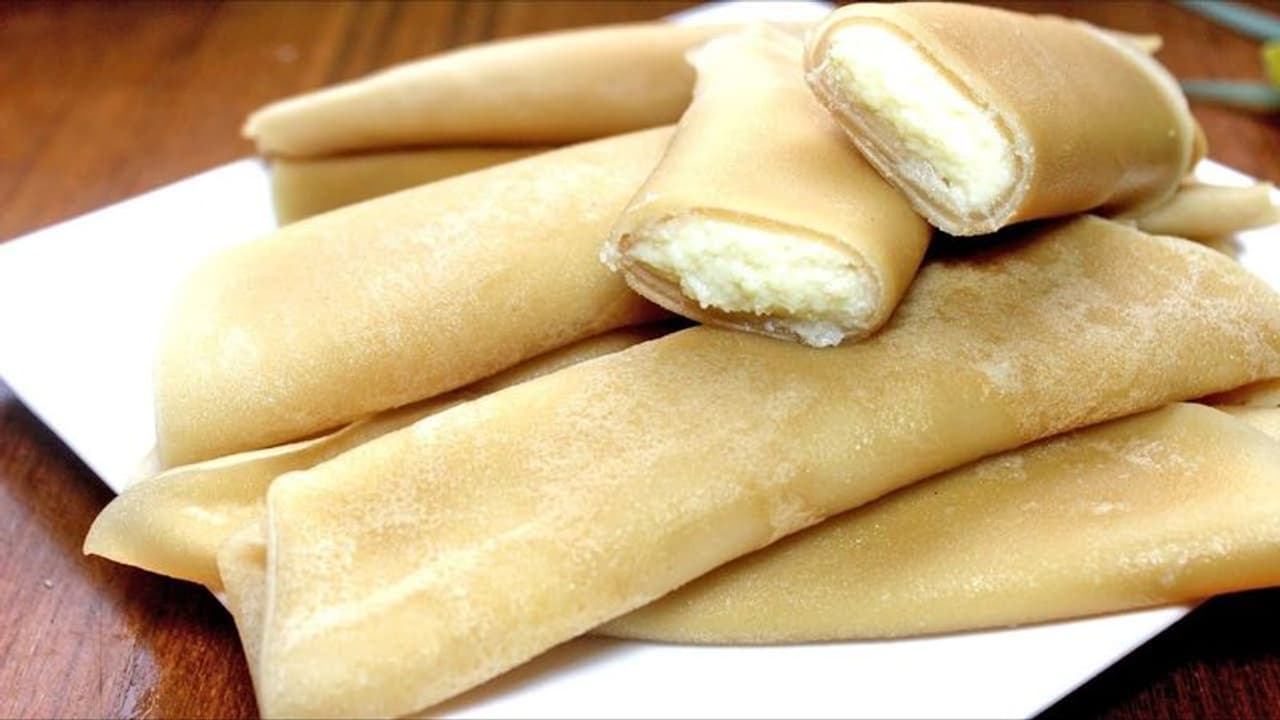 <p><strong>Patishapta – Bengal: </strong>There are two components to this stuffed dessert. First, the crispy crepe that is made with all purpose flour, and second is the sweet and crumbly jaggery, coconut or khoya filling that wrapped inside the crepe. These are further sweetened with condensed milk. Try making it at home, you won't stop at one, we dare you!<br />&nbsp;</p>