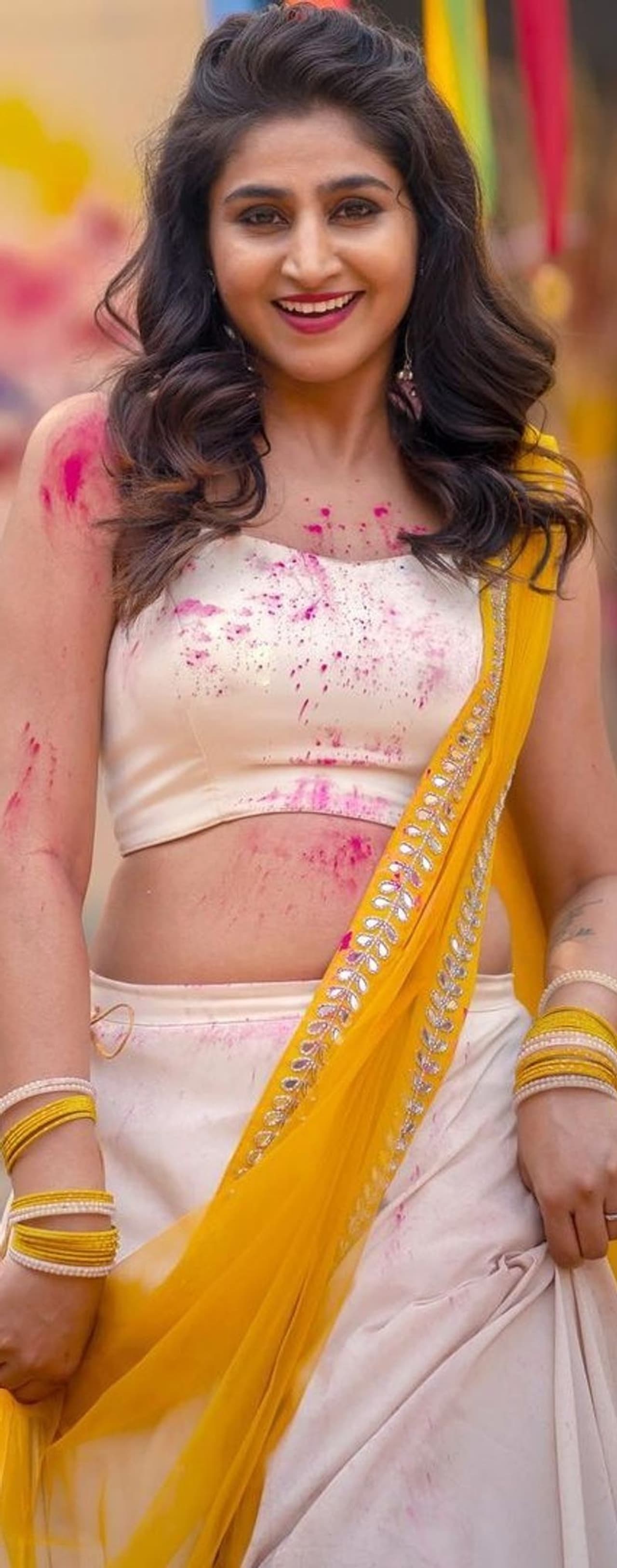 వైట్, ఎల్లో కాంబినేషన్ కలిగిన గాగ్రా చోళీ ధరించి హోలీ వేడుకలలో మైమరి ఆడింది భామ. ఇక వర్షిణి గుండెలపై నడుముపై గులాబీ రంగును ఎవరో చల్లారు. హోలీ రంగుల్లో మరింత మెరిసింది ఈ సెక్సీ భామ. వైట్, ఎల్లో కాంబినేషన్ కలిగిన గాగ్రా చోళీ ధరించి హోలీ వేడుకలలో మైమరి ఆడింది భామ. ఇక వర్షిణి గుండెలపై నడుముపై గులాబీ రంగును ఎవరో చల్లారు. హోలీ రంగుల్లో మరింత మెరిసింది ఈ సెక్సీ భామ.