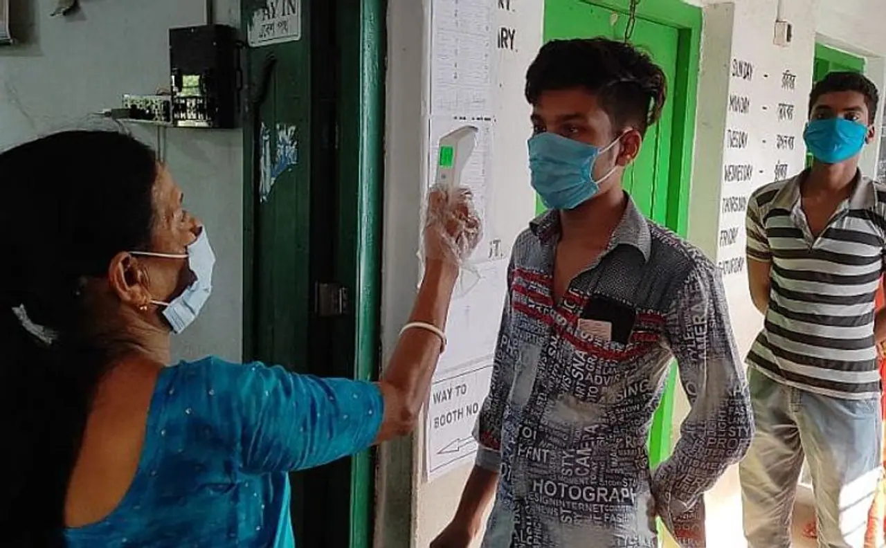 <p>Voting is underway in states of Kerala, West Bengal, Assam and Tamil Nadu, and in the Union Territory of Puducherry amid the second wave of Coronavirus sweeping through the country.<br />&nbsp;</p><p>The Election Commission had made elaborate arrangements to ensure the smooth progress of voting in 4 states and the Union Territory of Puducherry with adequate emphasis on maintaining Covid appropriate behaviour. <strong>Let's take a look.</strong><br />&nbsp;</p><p><em>(Above) Thermal checking being done at 111 (Purba Tapna Primary School) booth under Uluberia Dakshin assembly constituency of Howrah district, West Bengal.</em></p>