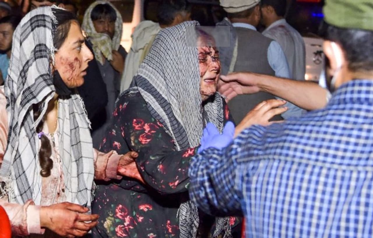 <p>Image: Wounded women arrive at a hospital for treatment after two blasts, which killed at least five and wounded a dozen, outside the airport in Kabul on August 26, 2021. Photograph: Wakil Kohsar/AFP/Getty Images</p>